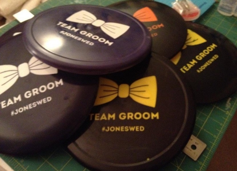 pile of custom team groom discs