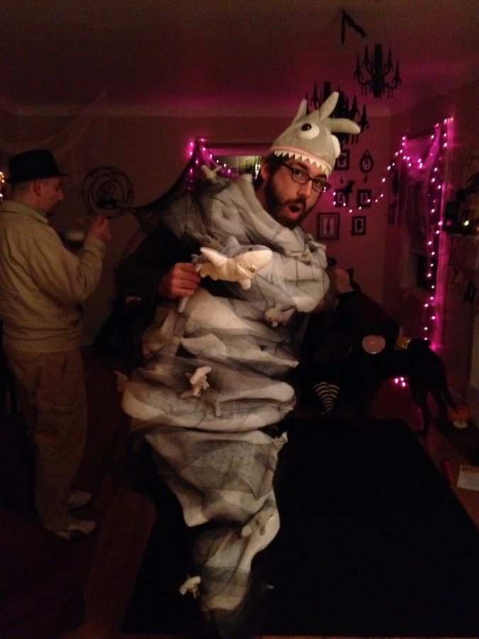 Man dressed as a Sharknado poses at Halloween party.